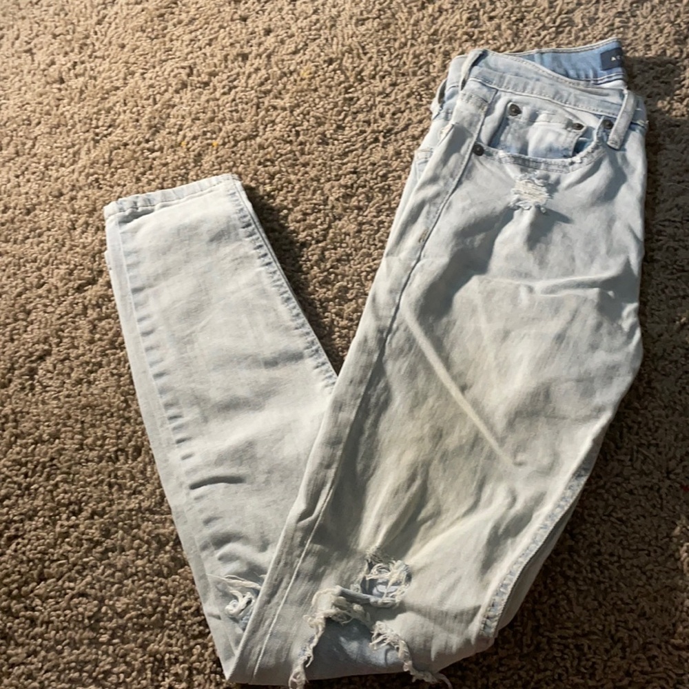 light blue ripped jeans